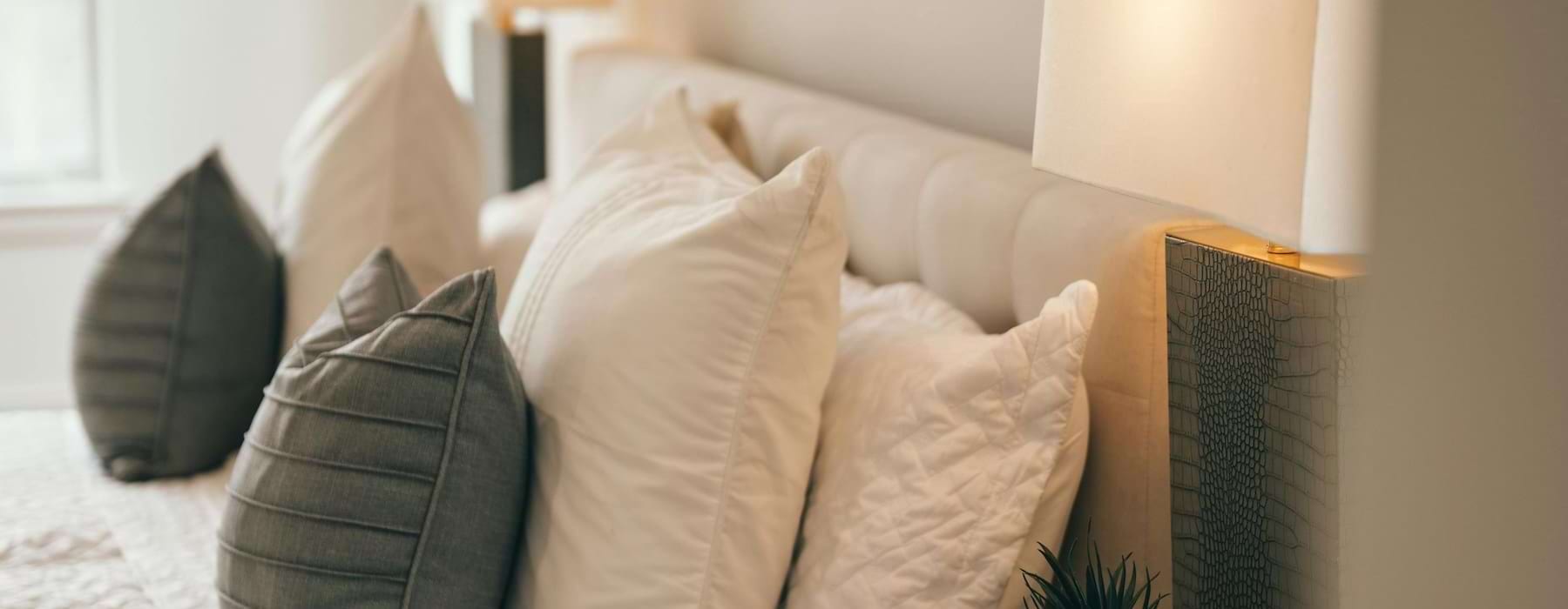 a bed with pillows